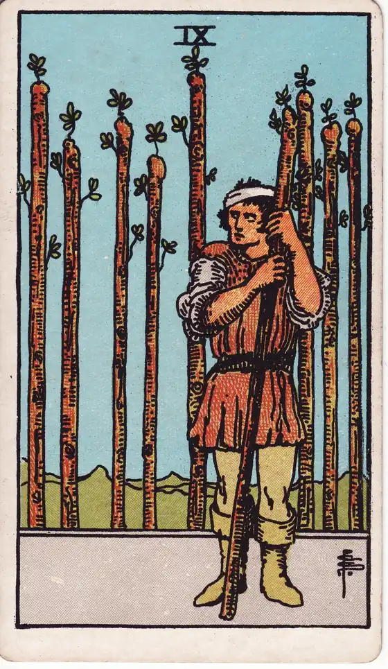 Nueve de Bastos, carta del tarot Rider-Waite-Smith